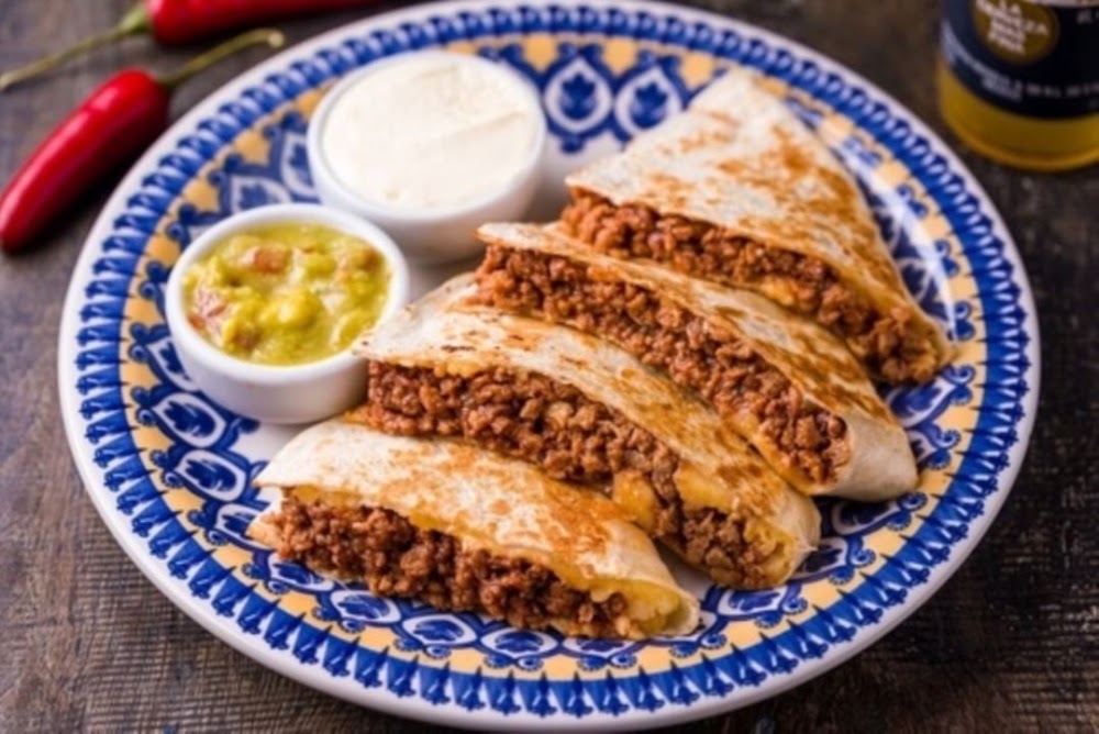 Chicken quesadillas with guacamole and sour cream
